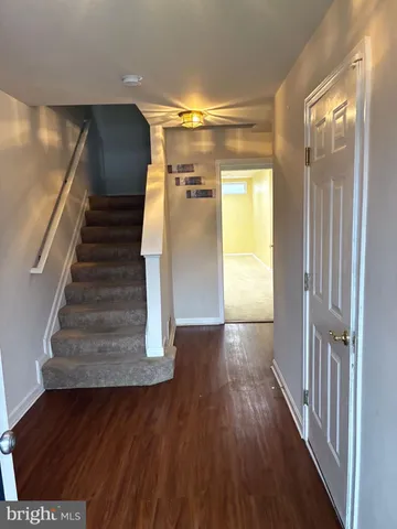 a view of entryway with wooden floor