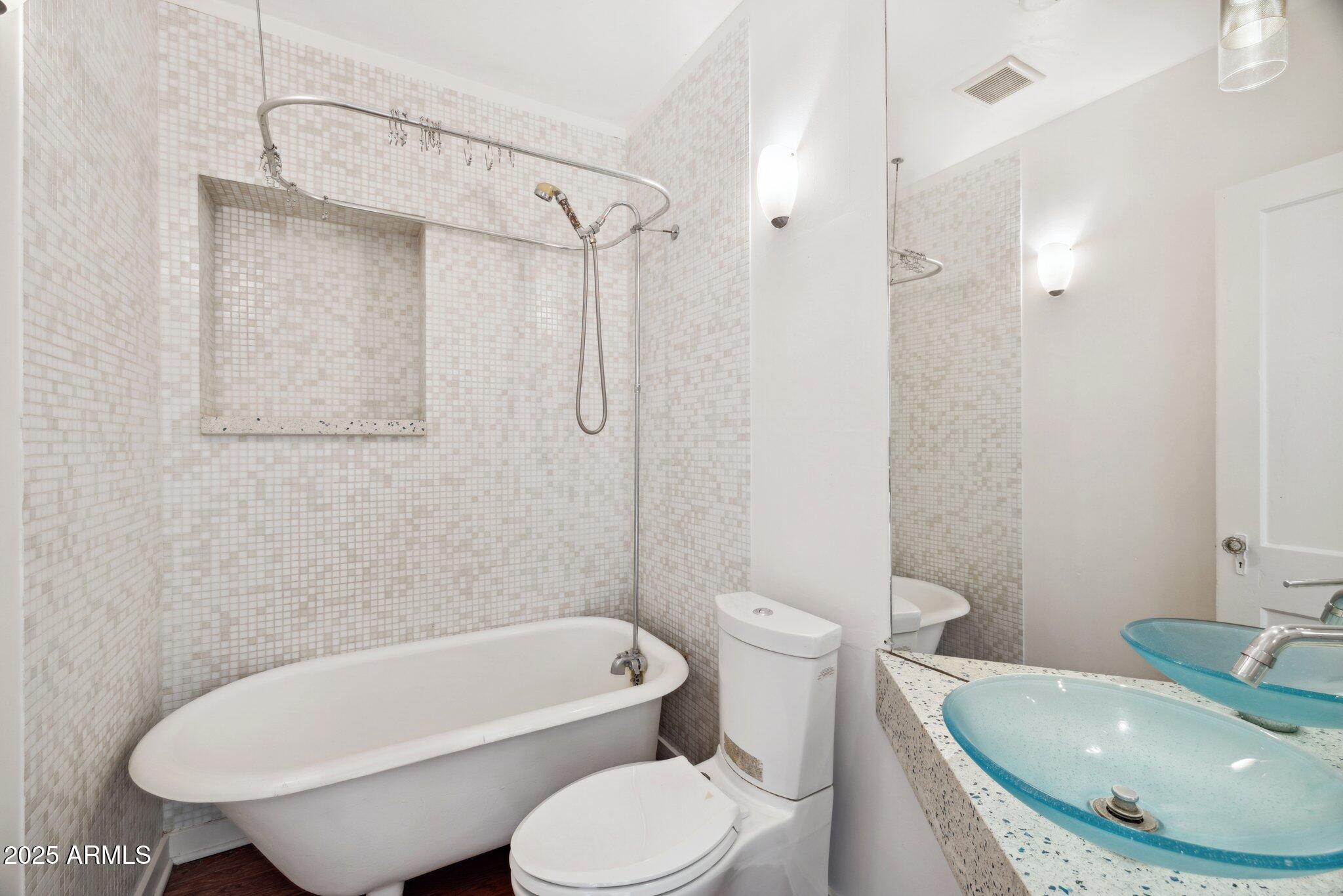 1614 East Roma Avenue Phoenix, AZ 85016 - Photo 19 of 44 a bathroom with a sink toilet and shower