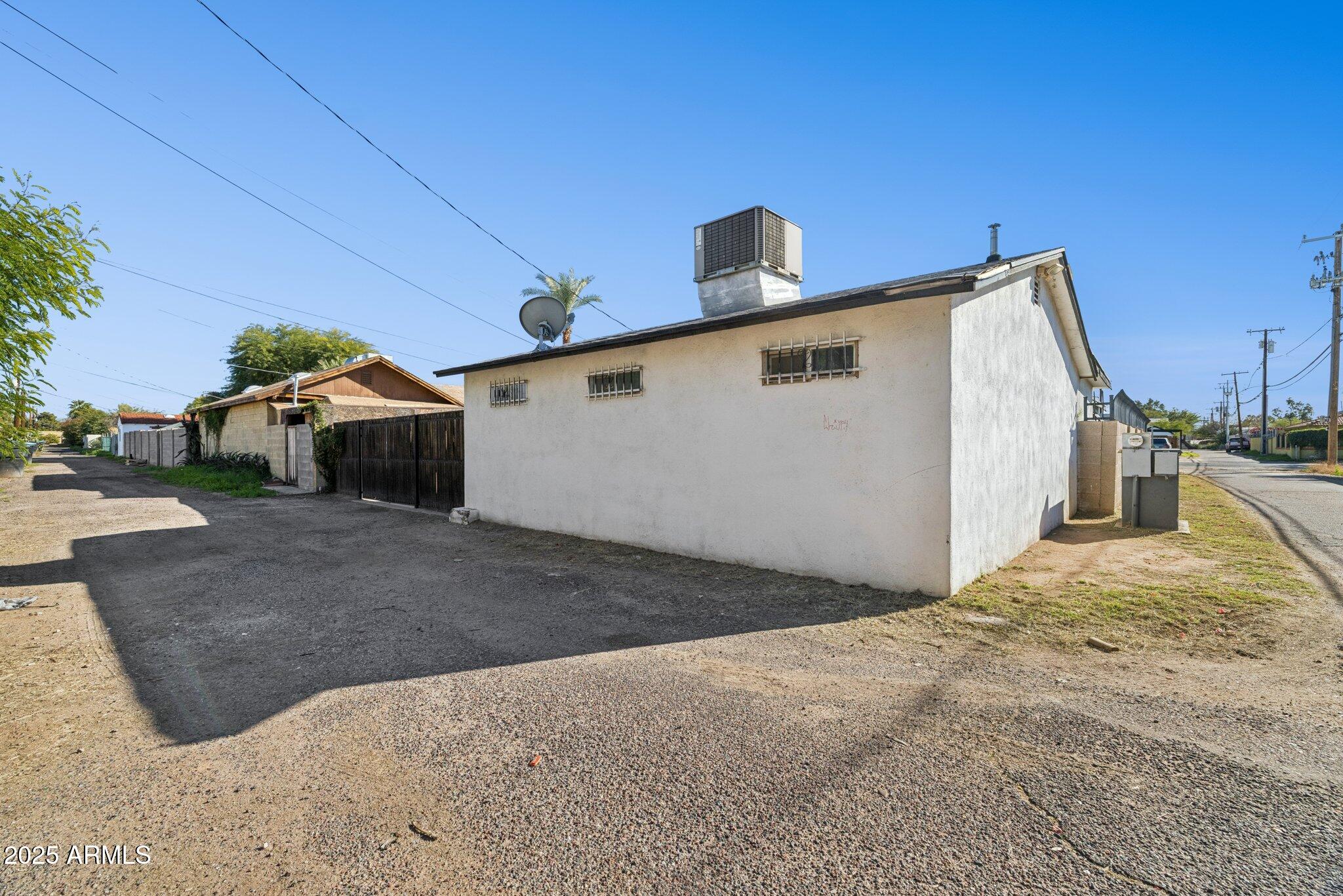 1614 East Roma Avenue Phoenix, AZ 85016 - Photo 22 of 44 a view of a house with a backyard