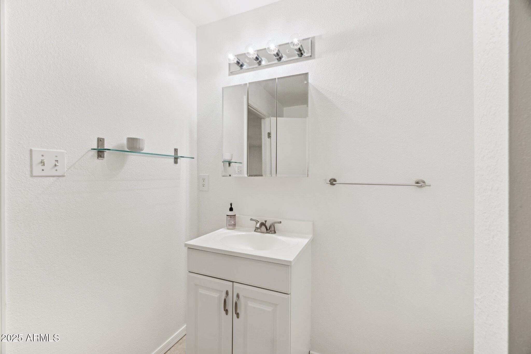 1614 East Roma Avenue Phoenix, AZ 85016 - Photo 35 of 44 Double shelves and updated vanity