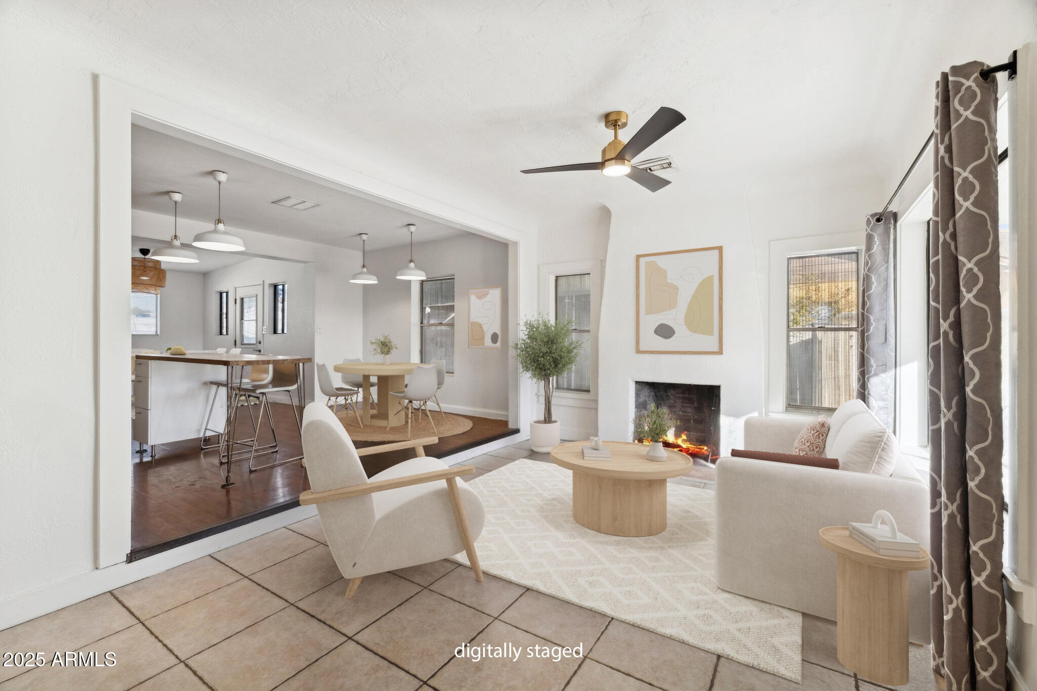 1614 East Roma Avenue Phoenix, AZ 85016 - Photo 5 of 44 a living room with furniture a fireplace and a chandelier