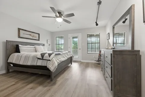 a bedroom with a bed and a tv