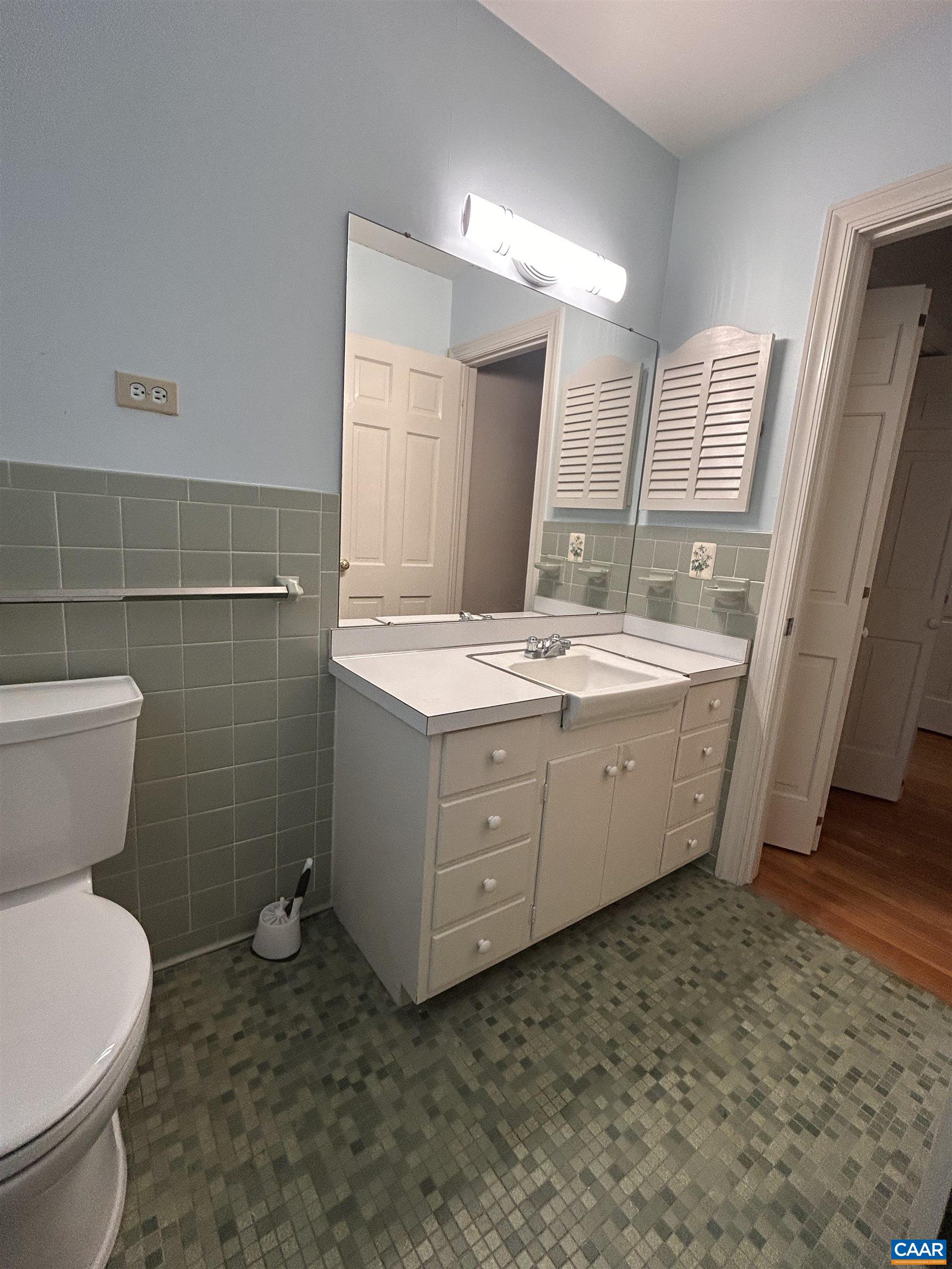 214 Montvue Drive Charlottesville, VA 22901 - Photo 17 of 30 a bathroom with a double vanity sink toilet and mirror