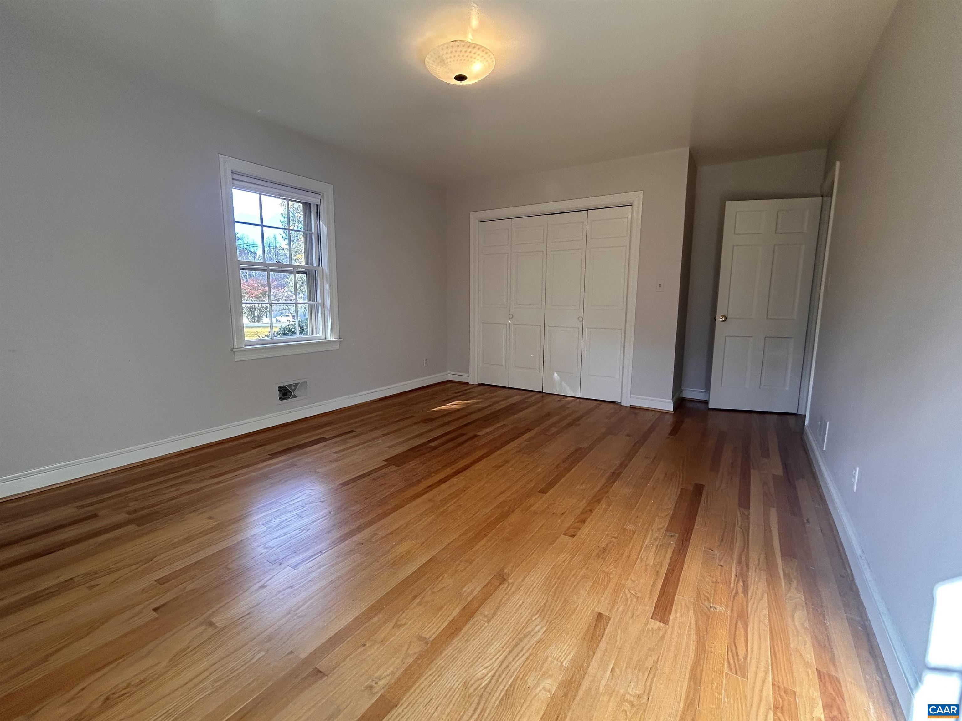 214 Montvue Drive Charlottesville, VA 22901 - Photo 19 of 30 a view of a room with wooden floor and window