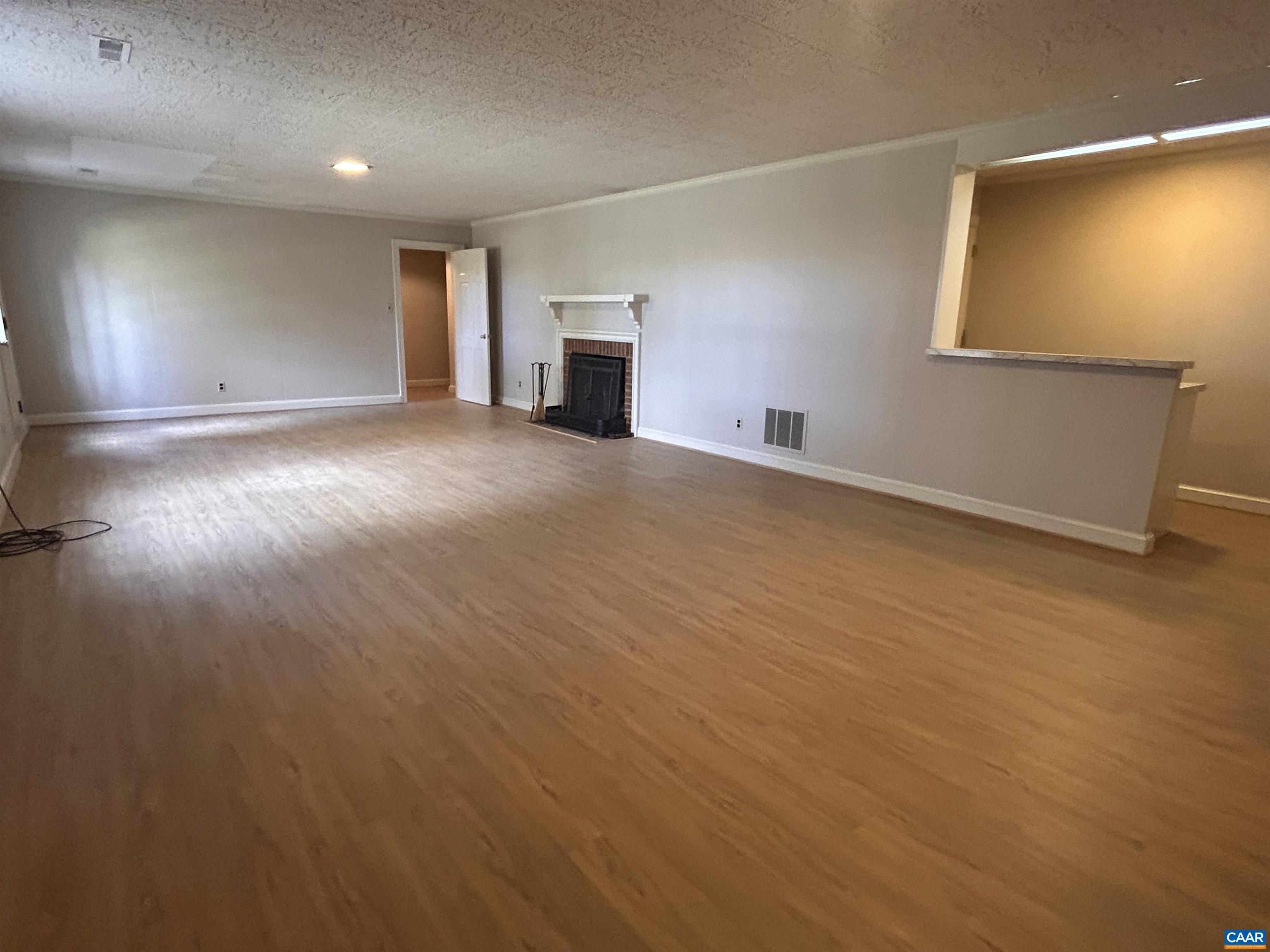 214 Montvue Drive Charlottesville, VA 22901 - Photo 22 of 30 an empty room with wooden floor and windows