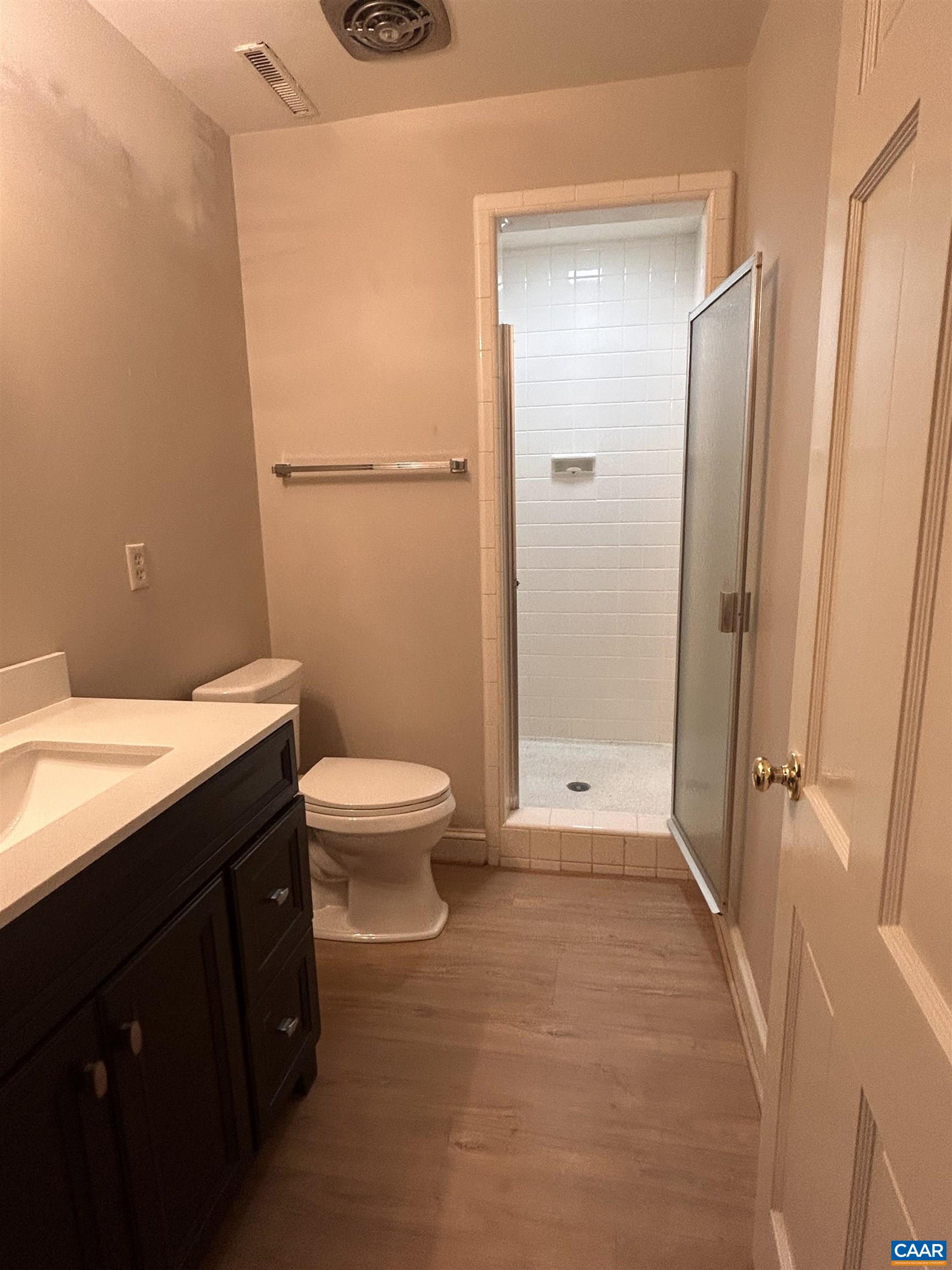 214 Montvue Drive Charlottesville, VA 22901 - Photo 26 of 30 a bathroom with a granite countertop sink toilet and shower