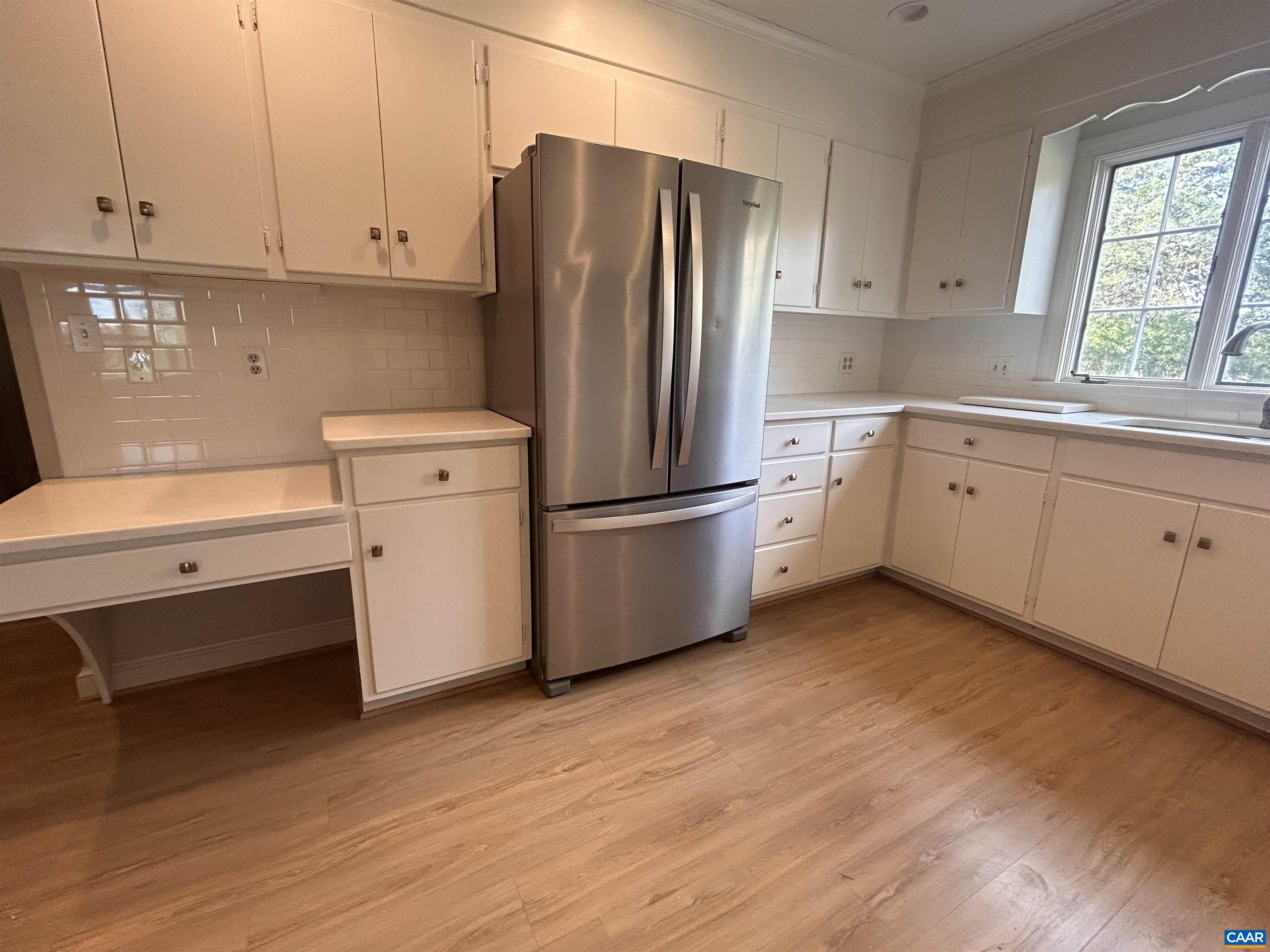 214 Montvue Drive Charlottesville, VA 22901 - Photo 8 of 30 a kitchen with a refrigerator sink and cabinets