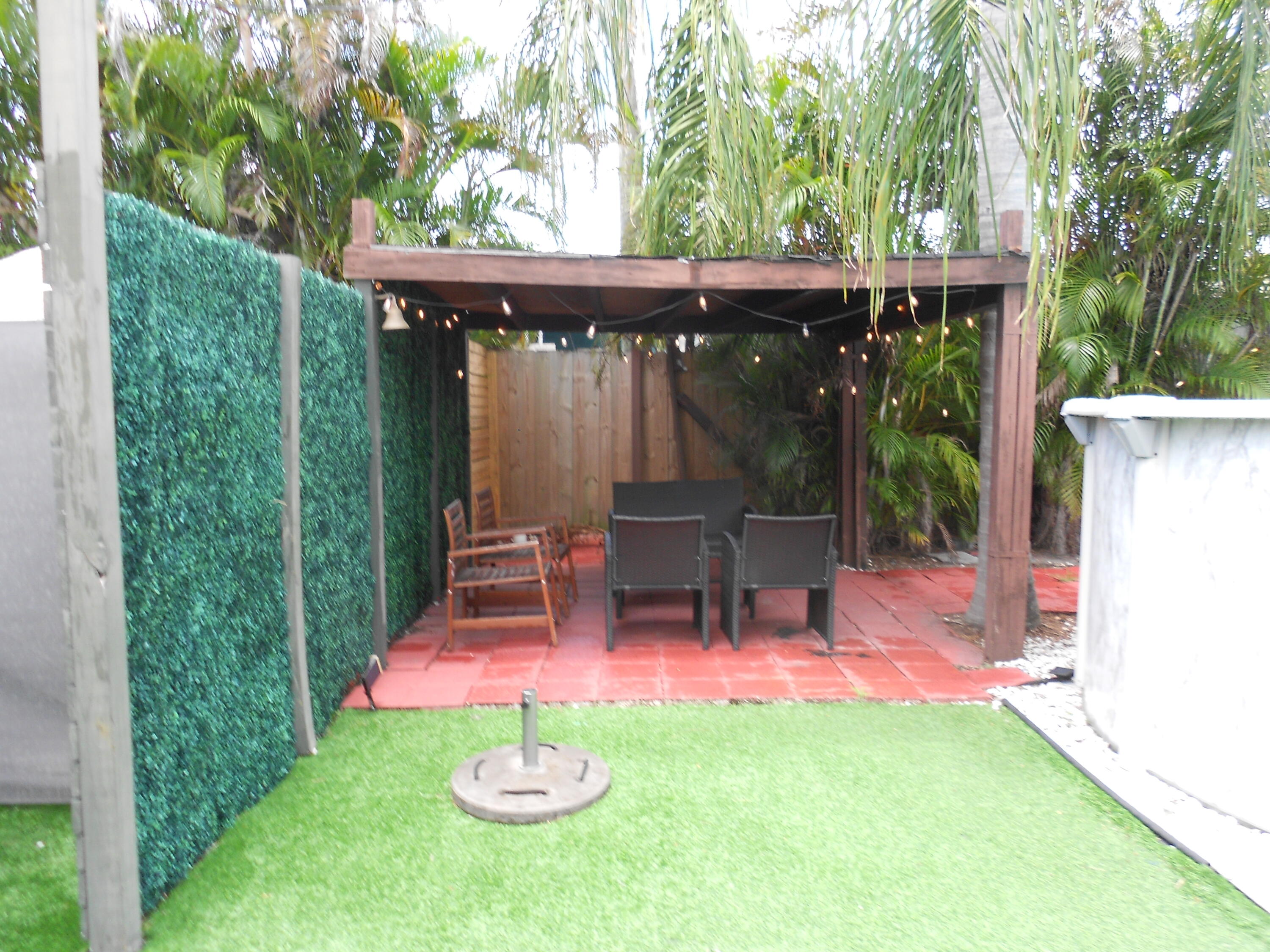 817 Northwest 30th Court Wilton Manors, FL 33311 - Photo 16 of 17 a view of outdoor space yard deck patio and outdoor seating