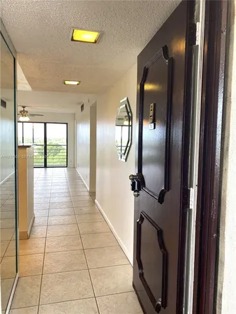 a bathroom with a mirror and a shower