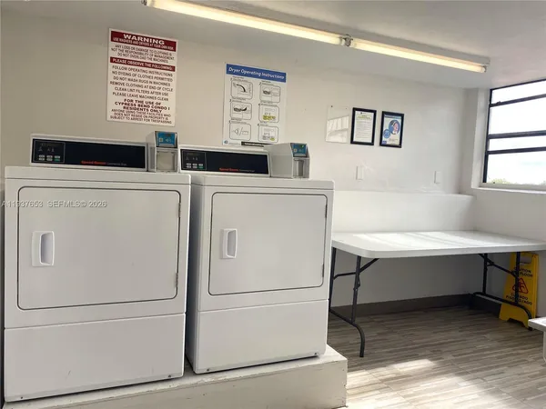 a room with a sink and a mirror