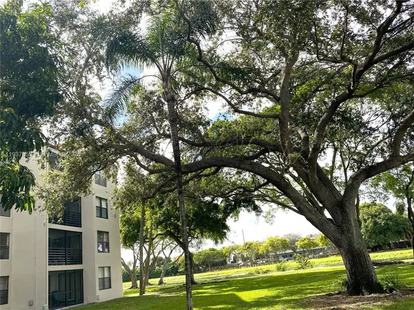 a view of a yard with swimming pool
