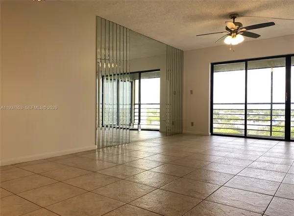 a view of a hallway with windows