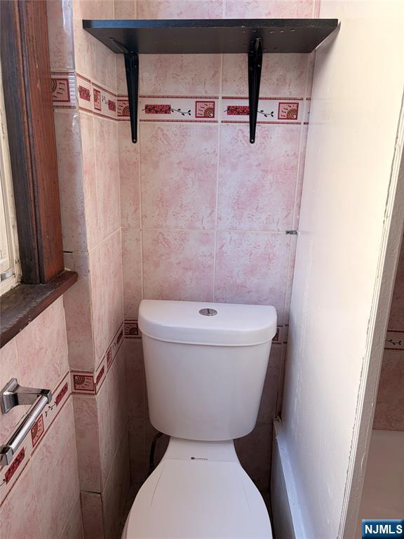 35 Marsellus Place, Unit 1 Garfield, NJ 07026 - Photo 23 of 37 a bathroom with a toilet and a shower