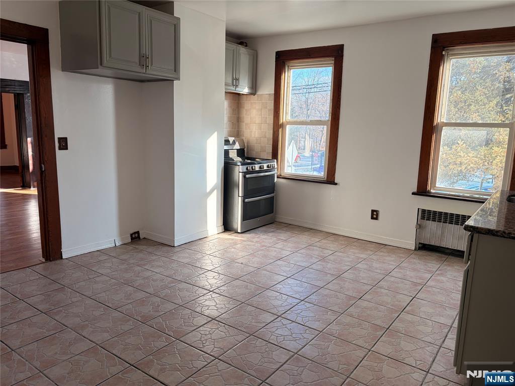 35 Marsellus Place, Unit 1 Garfield, NJ 07026 - Photo 31 of 37 a view of a kitchen with furniture and windows