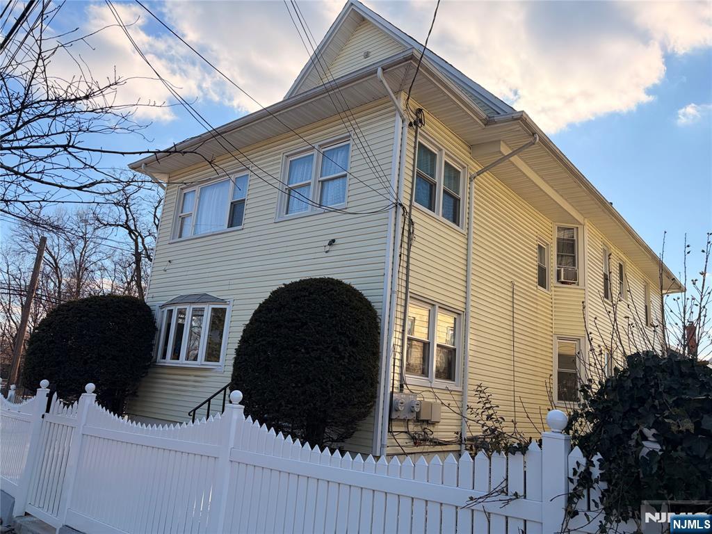 35 Marsellus Place, Unit 1 Garfield, NJ 07026 - Photo 4 of 37 a front view of a house with a yard