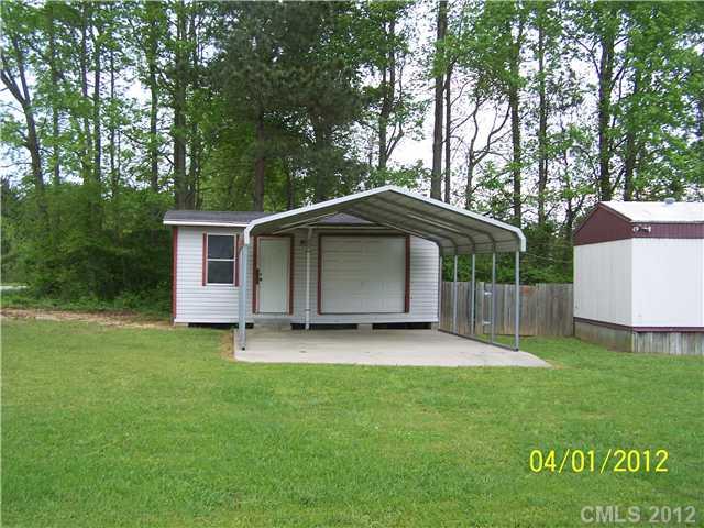 1045 State Line Road Pageland, SC 29728 - Photo 2 of 3 a view of a house with a yard