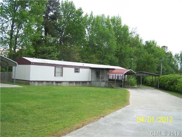 1045 State Line Road Pageland, SC 29728 - Photo 3 of 3 a view of a house with a yard and sitting area