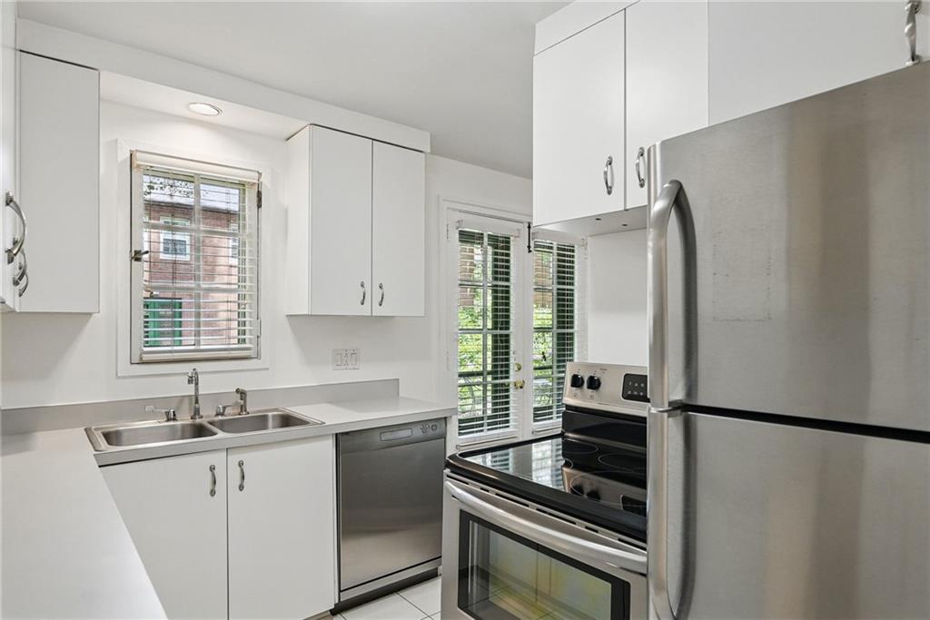 446 Olympia Road Pittsburgh, PA 15211 - Photo 14 of 31 a kitchen with a refrigerator and a sink