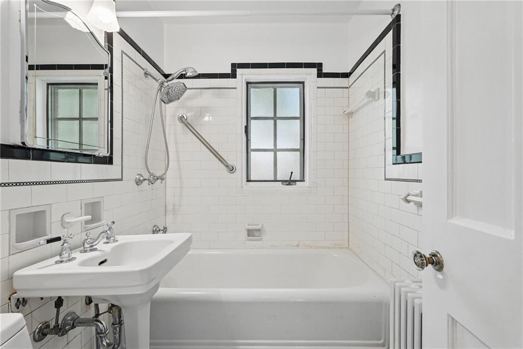 446 Olympia Road Pittsburgh, PA 15211 - Photo 16 of 31 a bathroom with a sink and a bathtub