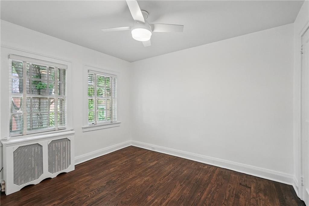 446 Olympia Road Pittsburgh, PA 15211 - Photo 19 of 31 an empty room with wooden floor and windows