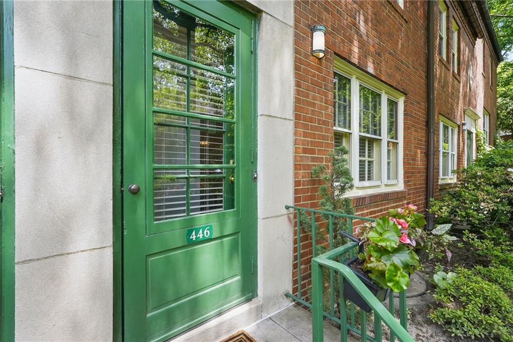 446 Olympia Road Pittsburgh, PA 15211 - Photo 4 of 31 a green field with potted plants in front of door