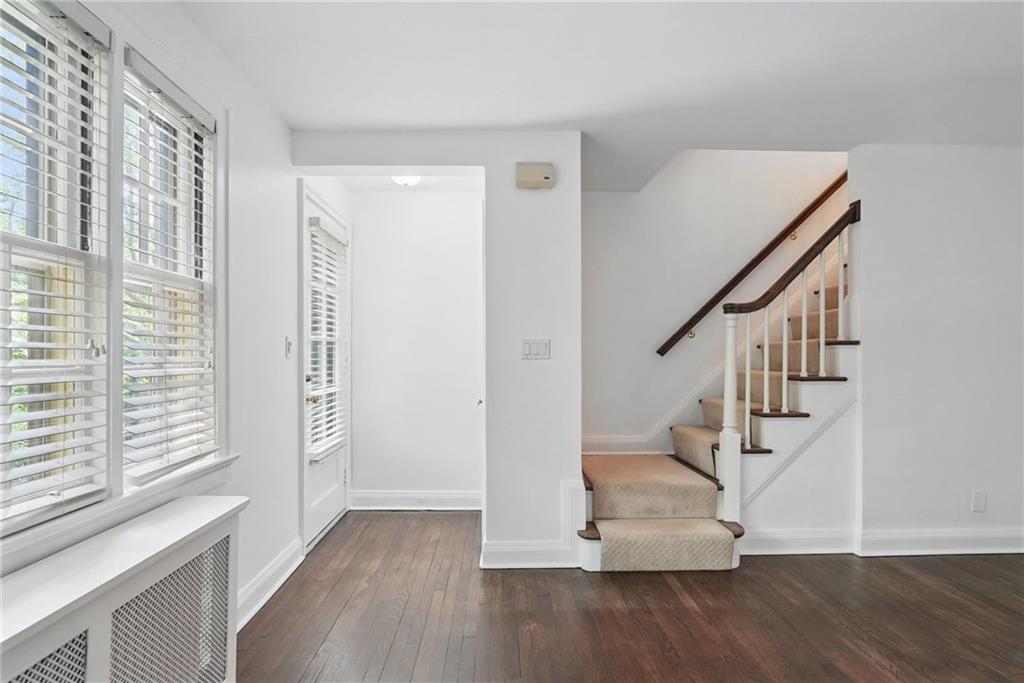 446 Olympia Road Pittsburgh, PA 15211 - Photo 5 of 31 a view of entryway with wooden floor and stairs