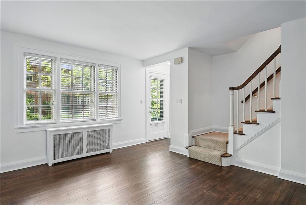 446 Olympia Road Pittsburgh, PA 15211 - Photo 6 of 31 a view of an empty room with wooden floor and a window