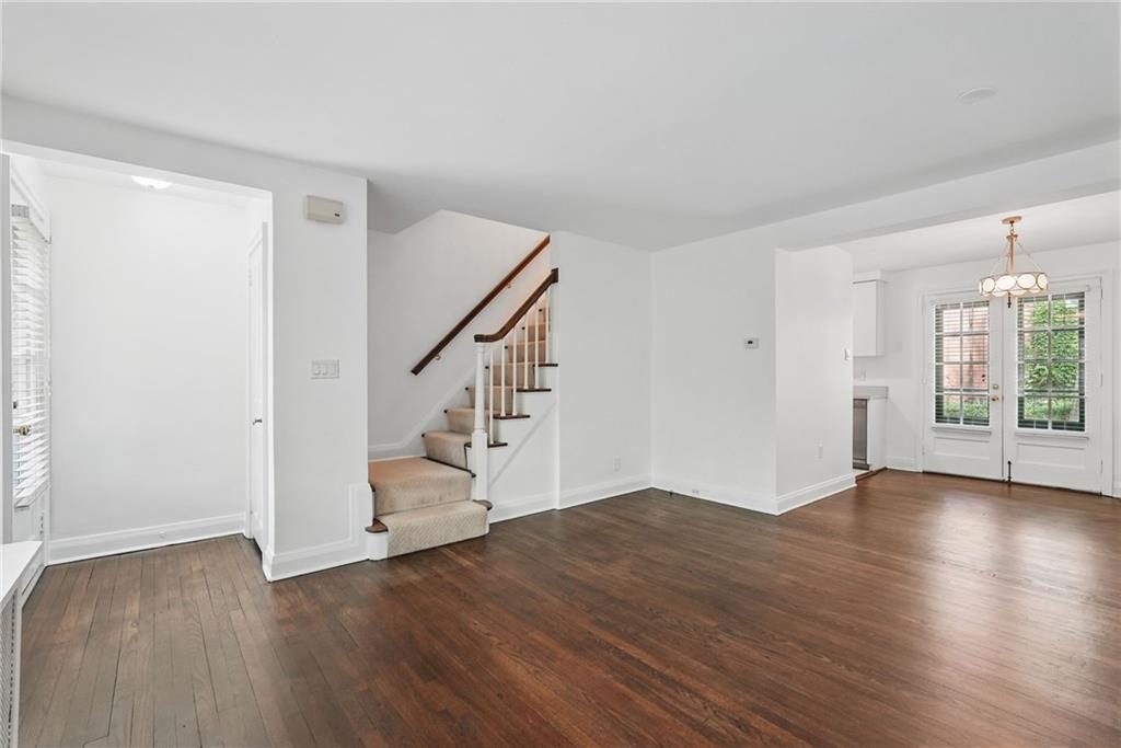 446 Olympia Road Pittsburgh, PA 15211 - Photo 7 of 31 wooden floor in an empty room with a window