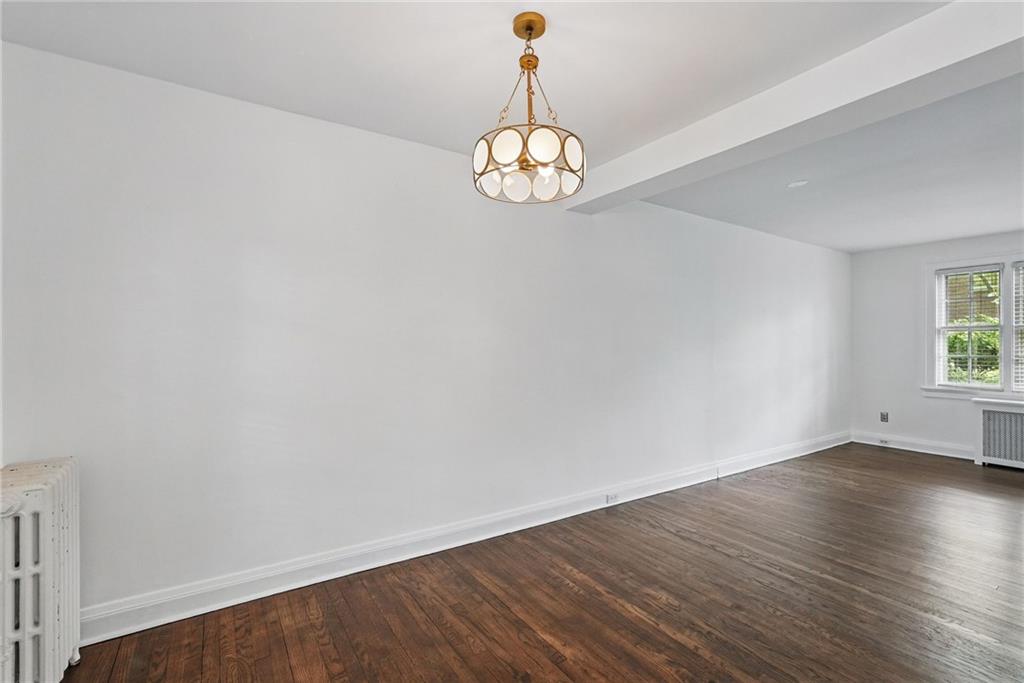 446 Olympia Road Pittsburgh, PA 15211 - Photo 10 of 31 an empty room with wooden floor and windows