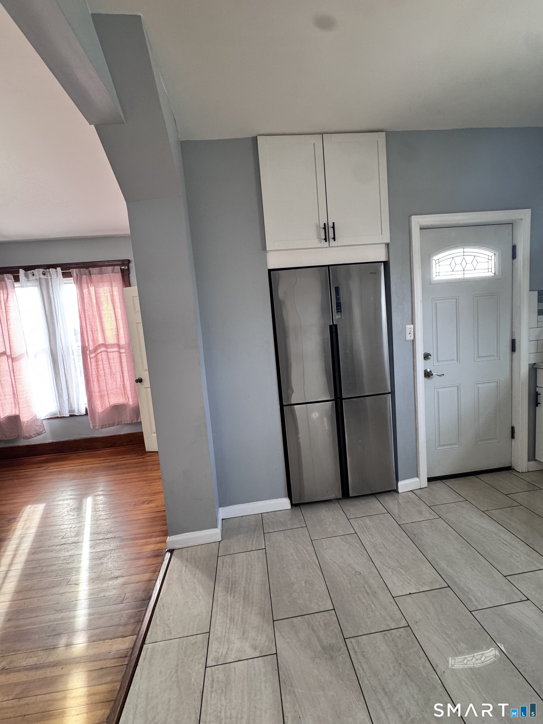 62 Marne Street Hamden, CT 06514 - Photo 12 of 26 a view of a refrigerator in kitchen and a window