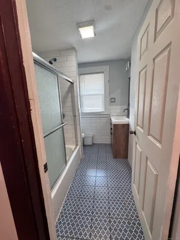 a kitchen with a refrigerator and a sink