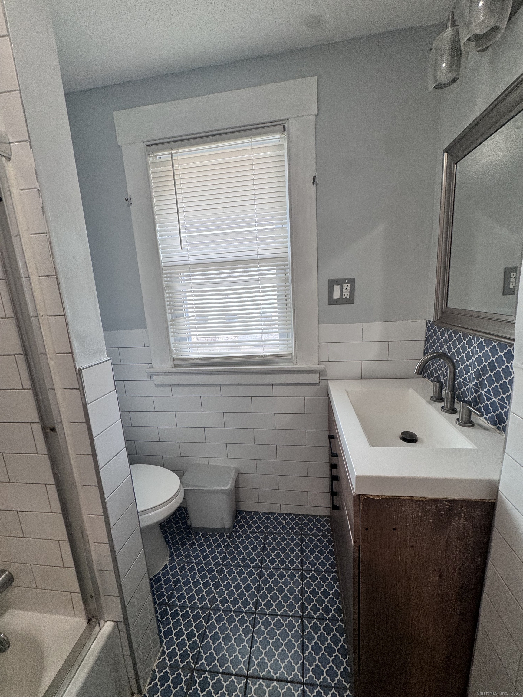 62 Marne Street Hamden, CT 06514 - Photo 22 of 26 a bathroom with a sink toilet and shower