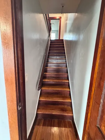 a view of an empty room with a ceiling fan