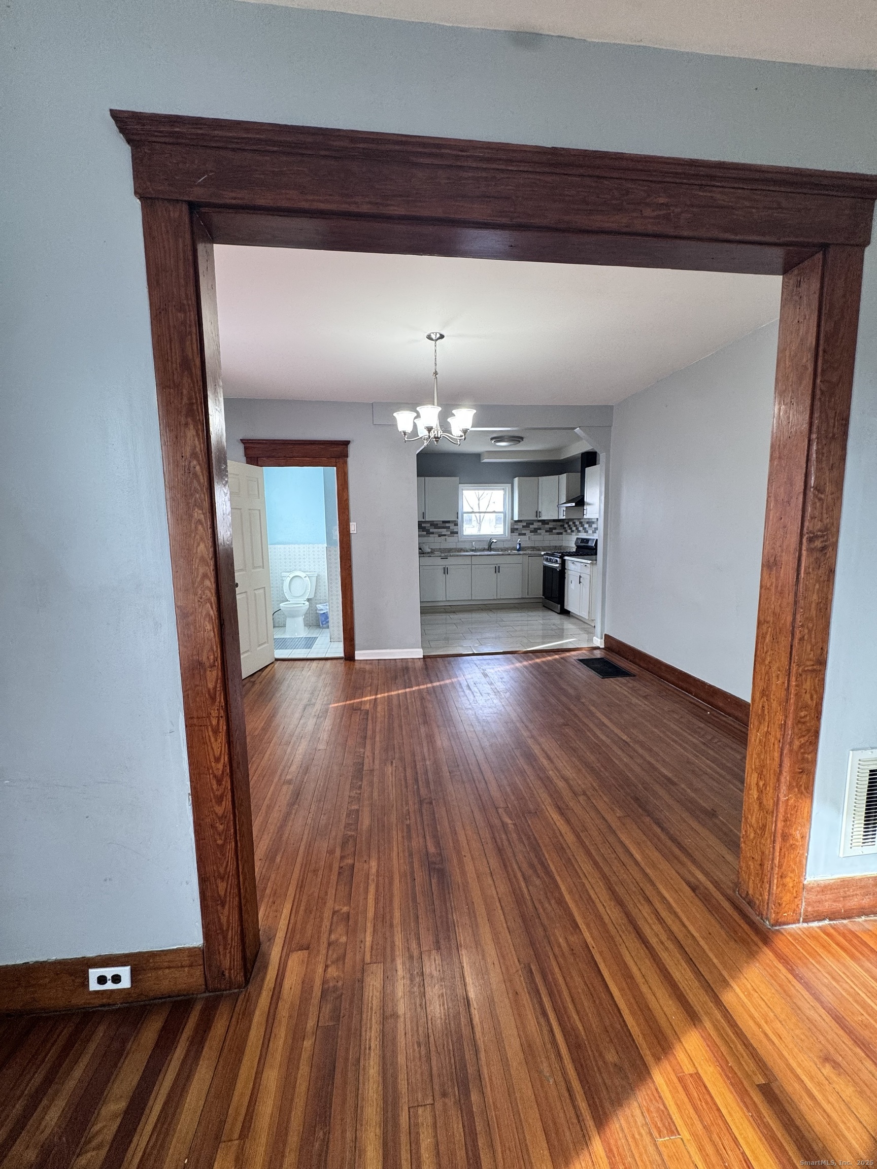62 Marne Street Hamden, CT 06514 - Photo 8 of 26 a view of empty room with wooden floor