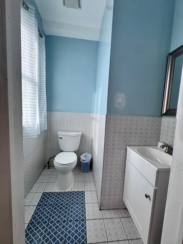 a bathroom with a toilet and a sink