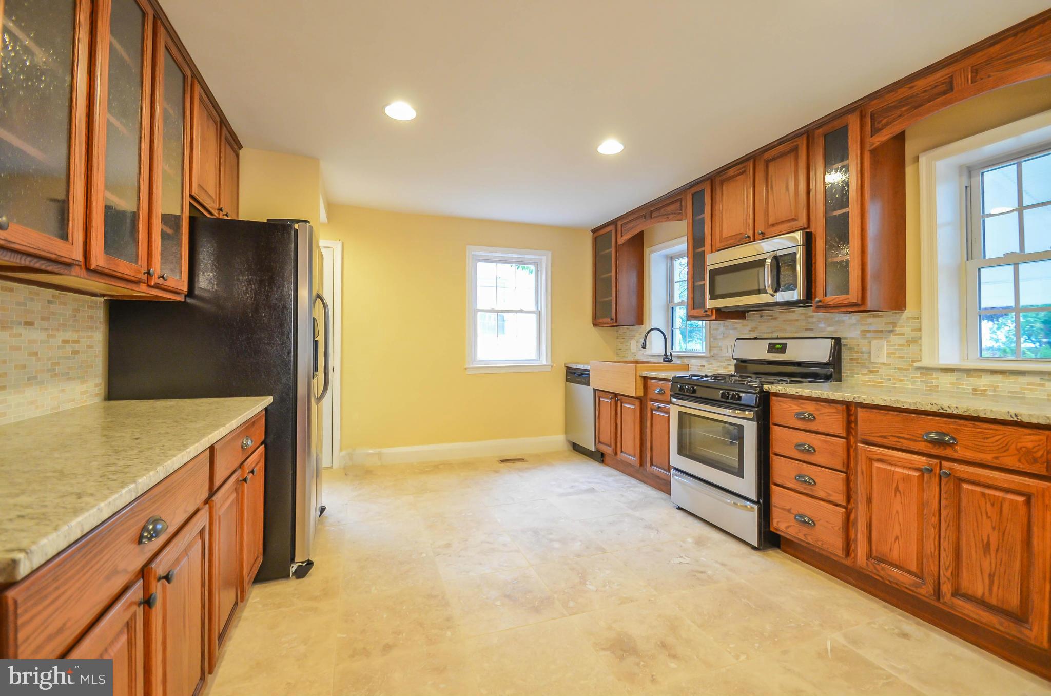 720 Overbrook Road Baltimore, MD 21212 - Photo 9 of 26 a kitchen with stainless steel appliances granite countertop a stove a sink and a refrigerator