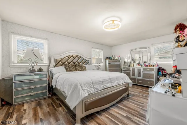 a bedroom with bed and a dresser