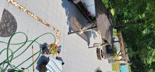 a view of a patio with table and chairs and wooden floor