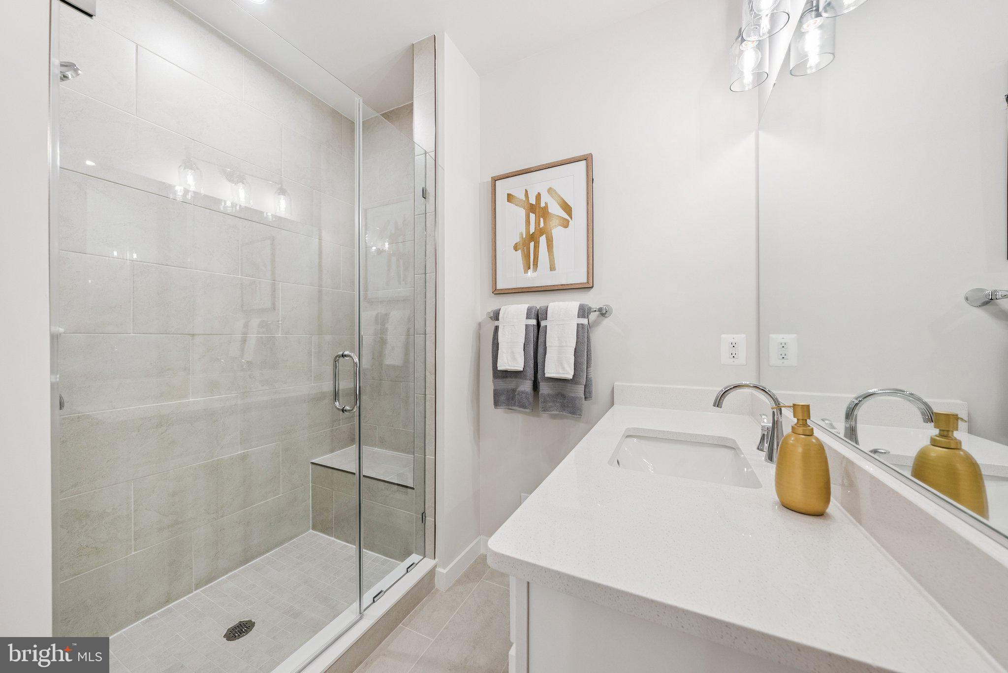 8630 Lovelace Street Manassas, VA 20110 - Photo 22 of 31 a bathroom with a sink and a shower