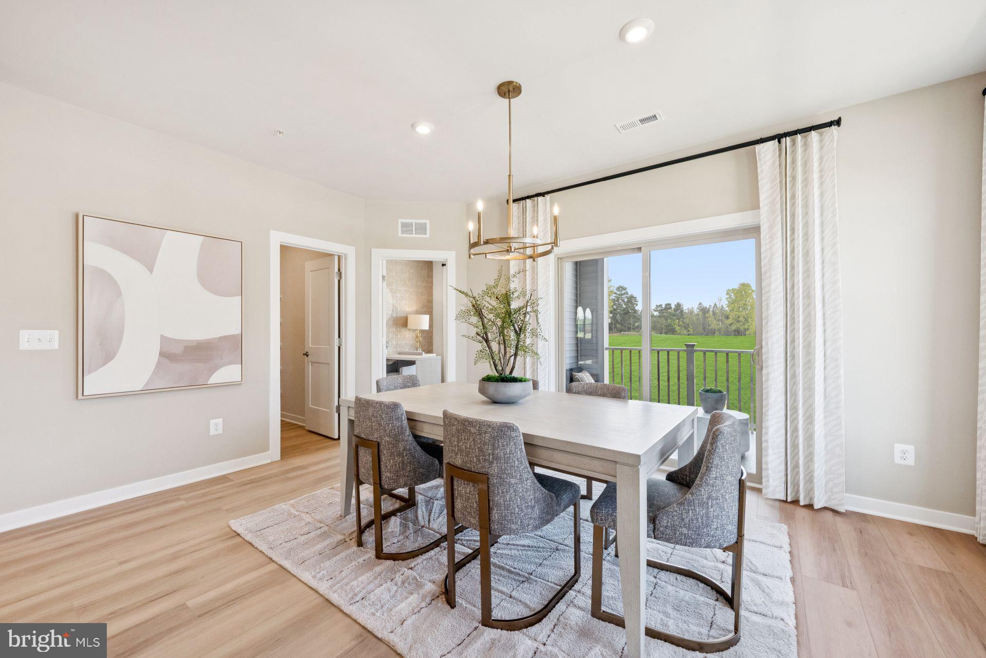 8630 Lovelace Street Manassas, VA 20110 - Photo 8 of 31 a view of a dining room with furniture window and wooden floor
