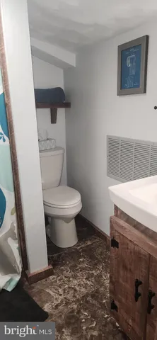 a bathroom with a toilet and a sink