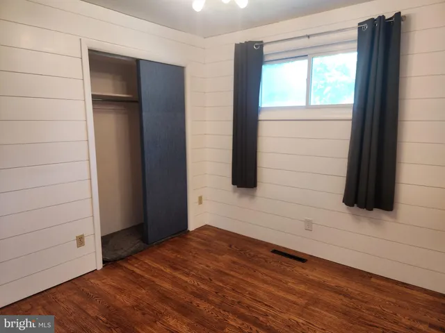 a bathroom with a toilet and a bathtub
