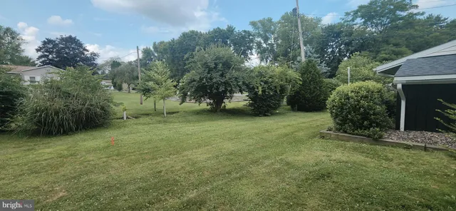 a bed sitting in a room next to a window