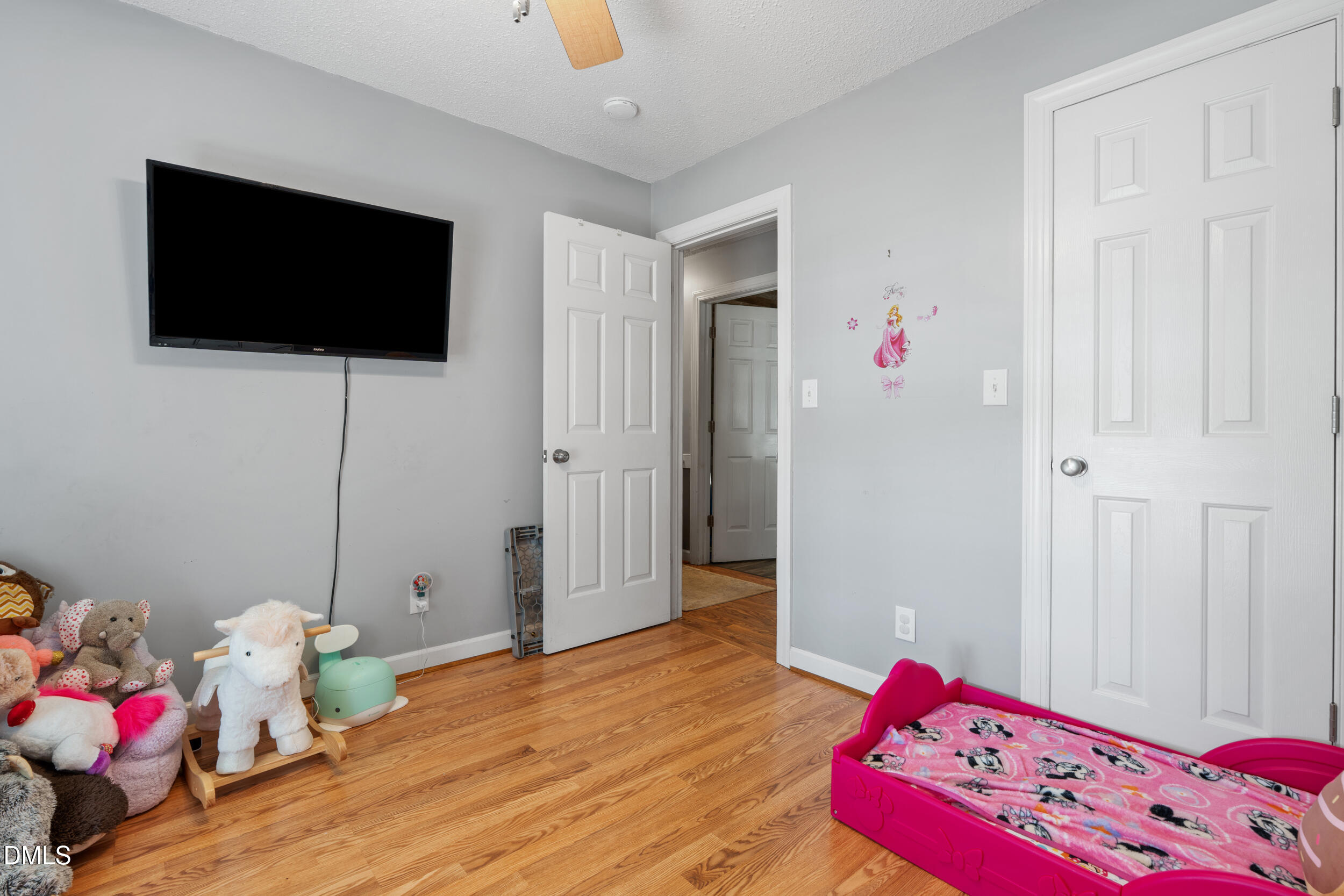 311 Bridgers Road Kenly, NC 27542 - Photo 21 of 46 a bedroom with a bed and flat screen tv