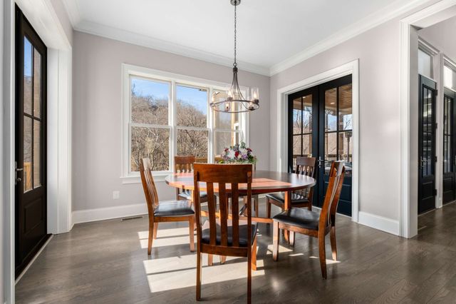 a bed room with a bed and a chandelier