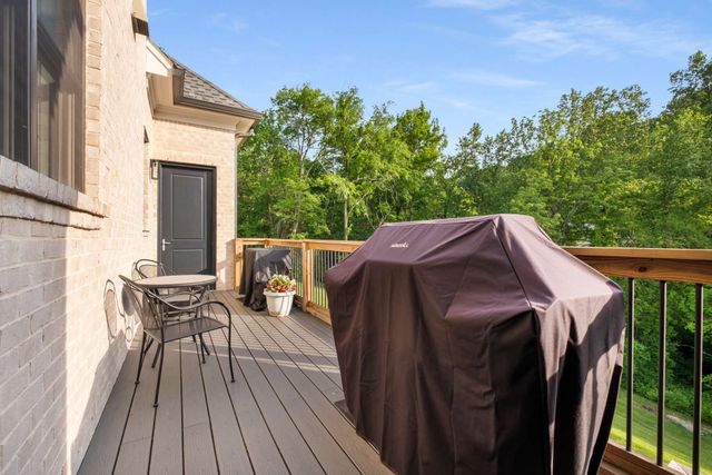 a bedroom with a bed and a desk