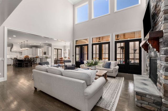 a view of a house with a yard and sitting area