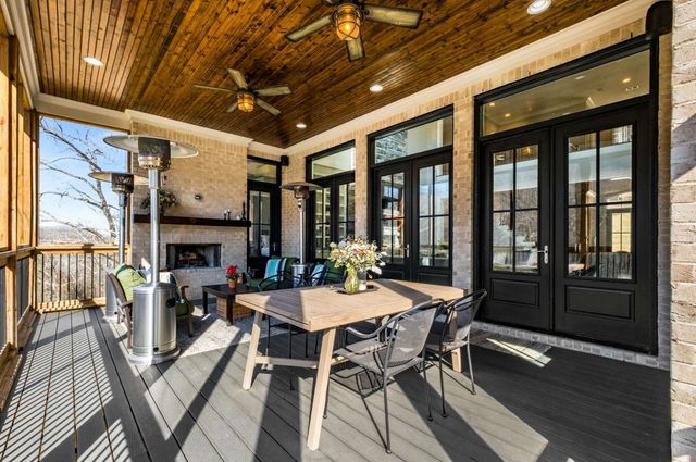 an aerial view of residential house with outdoor space and swimming pool