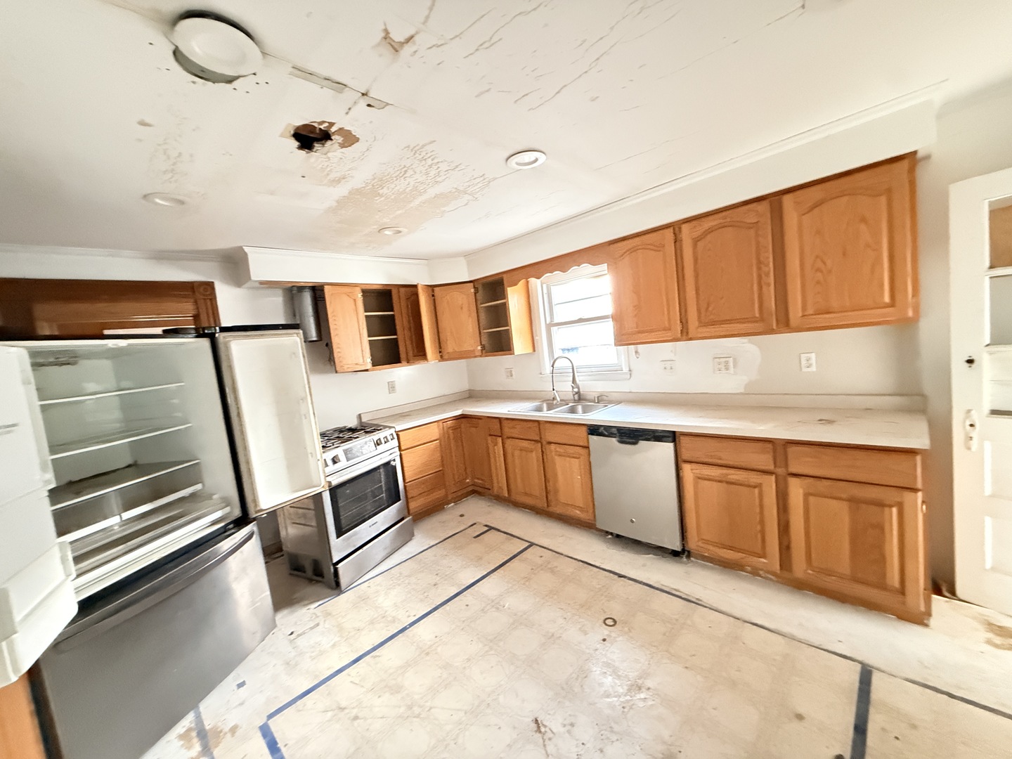 101 5th Street Carmi, IL 62821 - Photo 2 of 28 a kitchen with stainless steel appliances kitchen island granite countertop a stove a sink and dishwasher