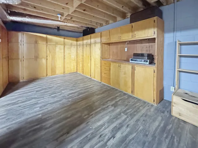a view of a kitchen with wooden floor